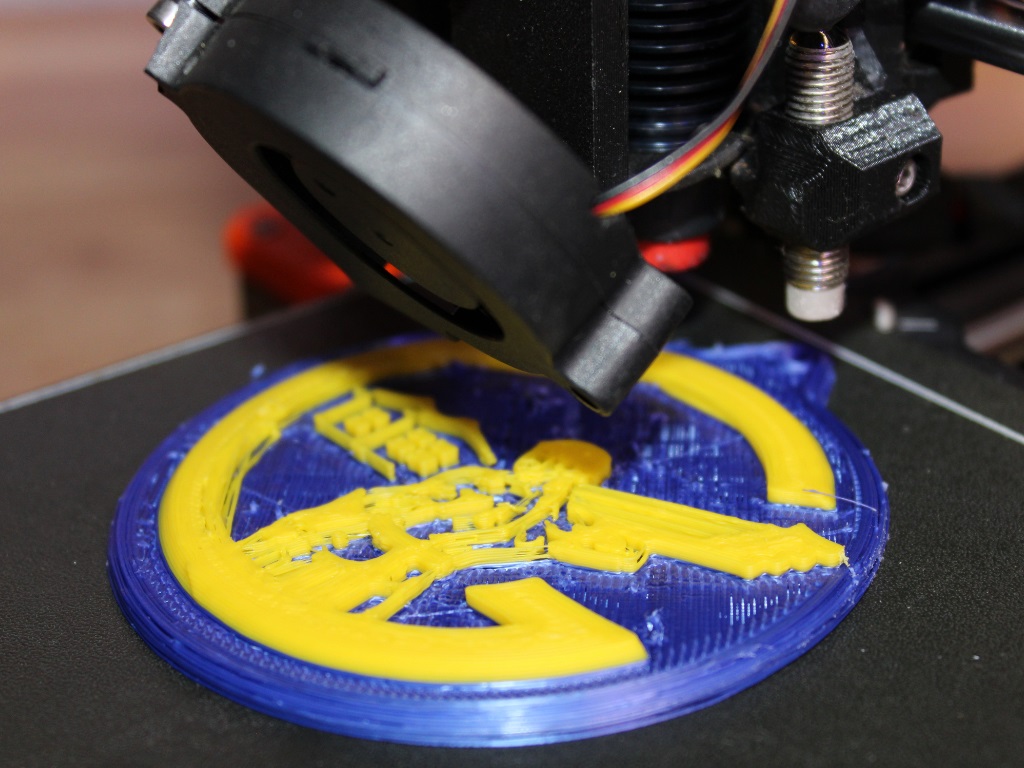 Close up of circular disk being 3D printed